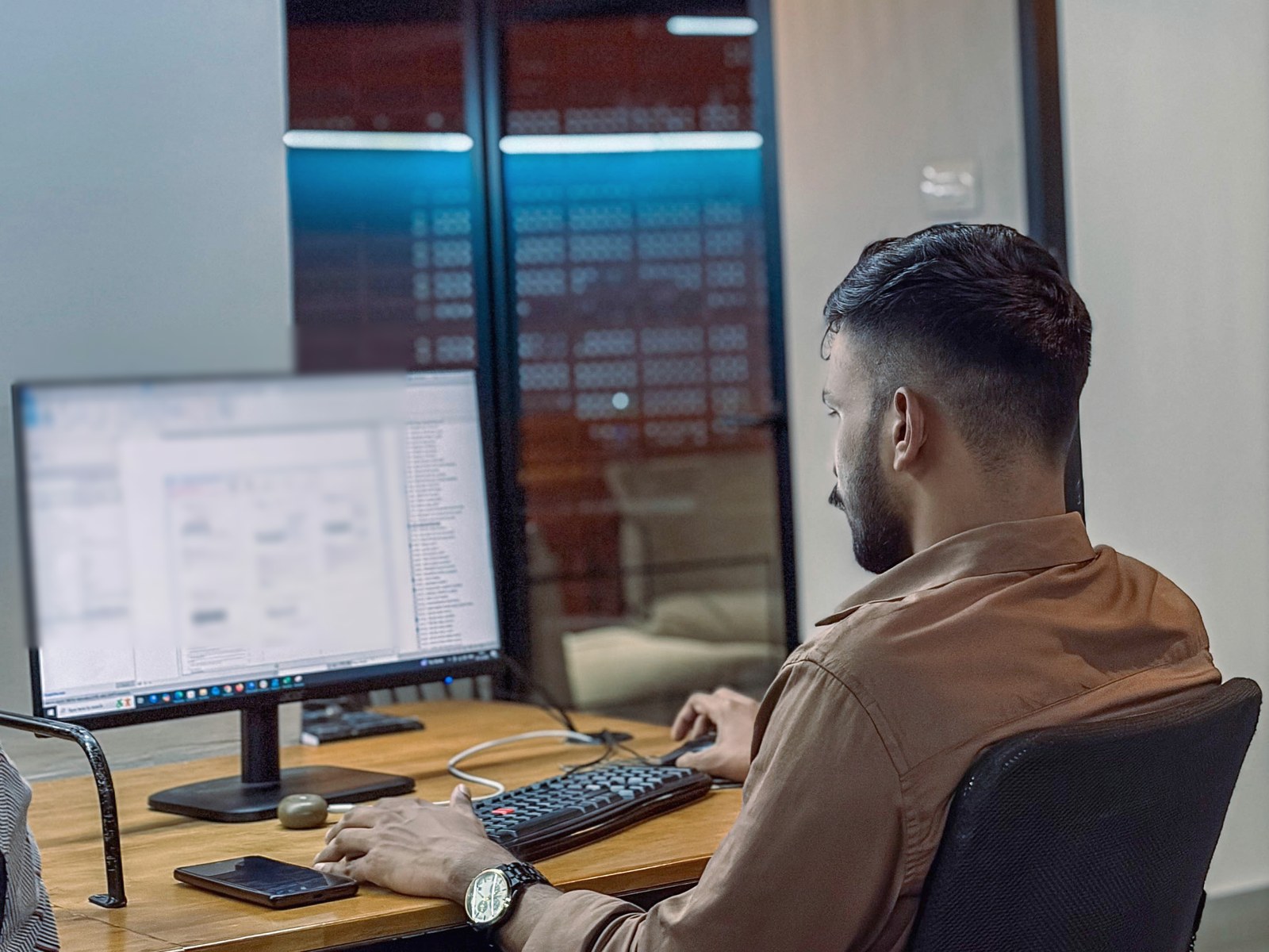 MJ Designs BIM specialist working at a design workstation